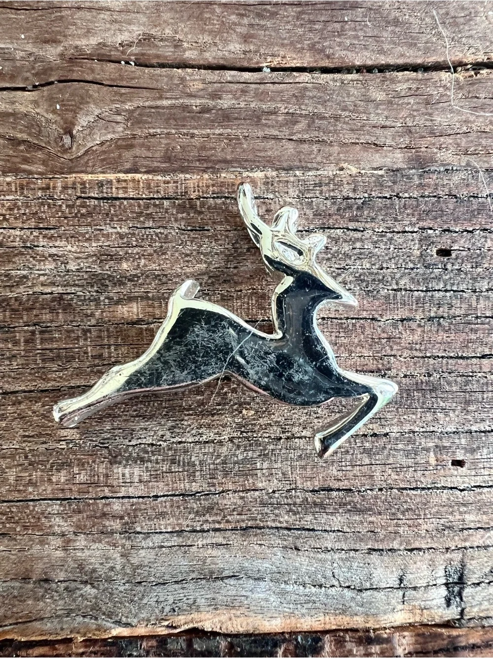 vintage running deer brooch features a stylized, jumping design. Silver tone